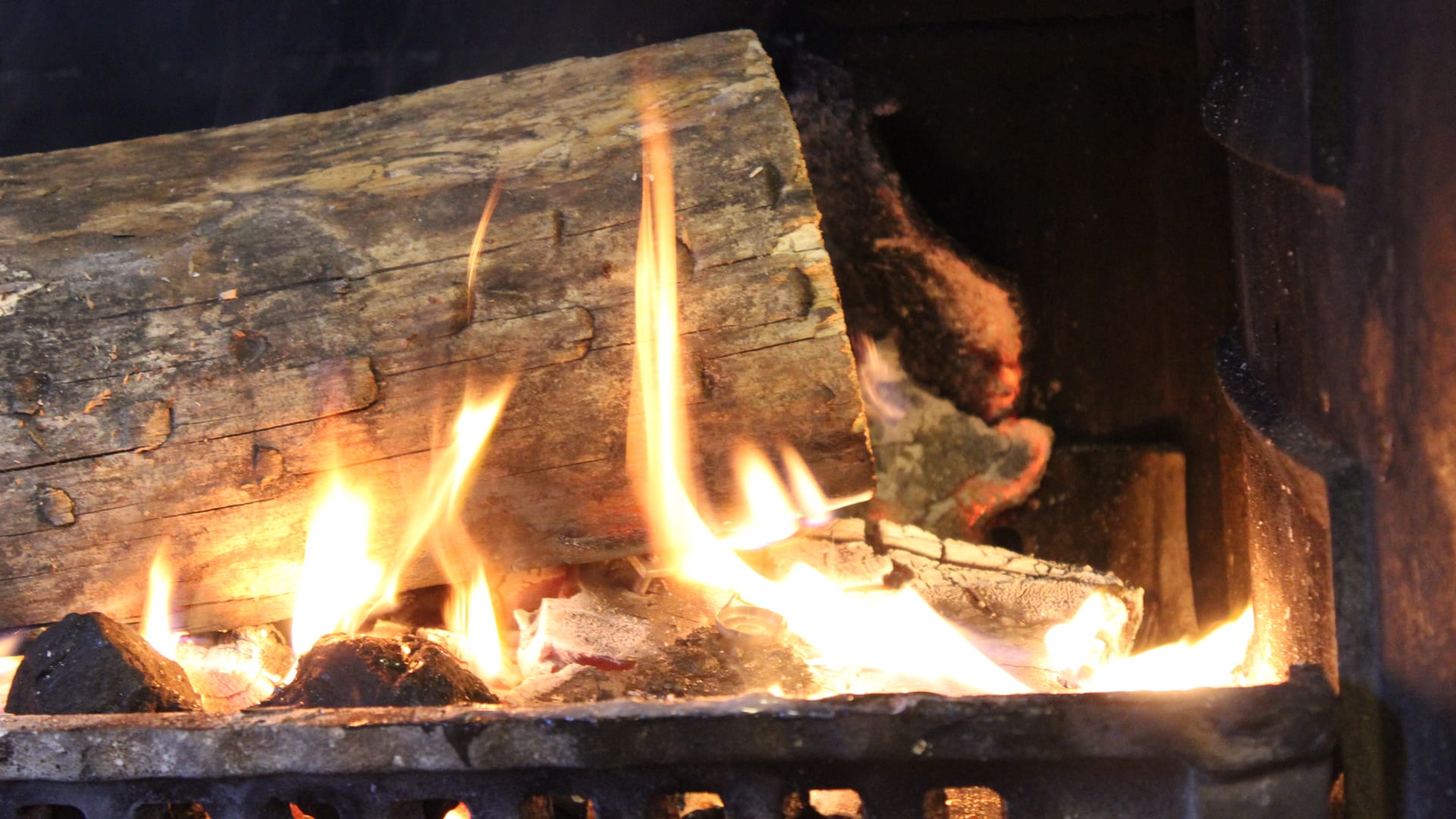 Log fire at a winter break at an independent hostel