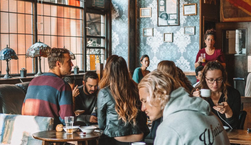 people in the bar at the walrus hostel london