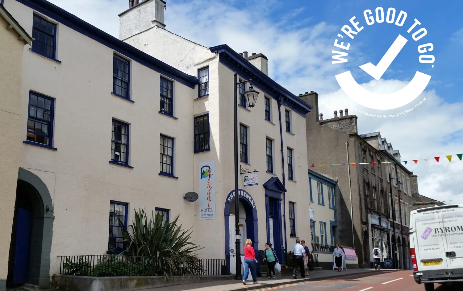 KEndal Hostel outside wit the We're good to go logo