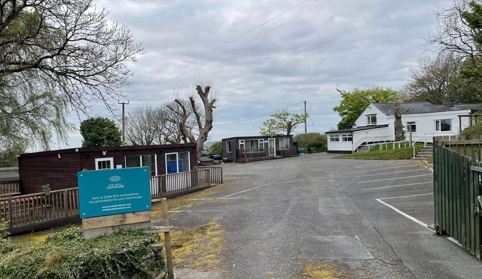 Exterior view of buildings and large car park