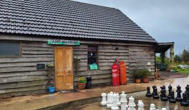Outside of the bunkhouse with a garden chess set