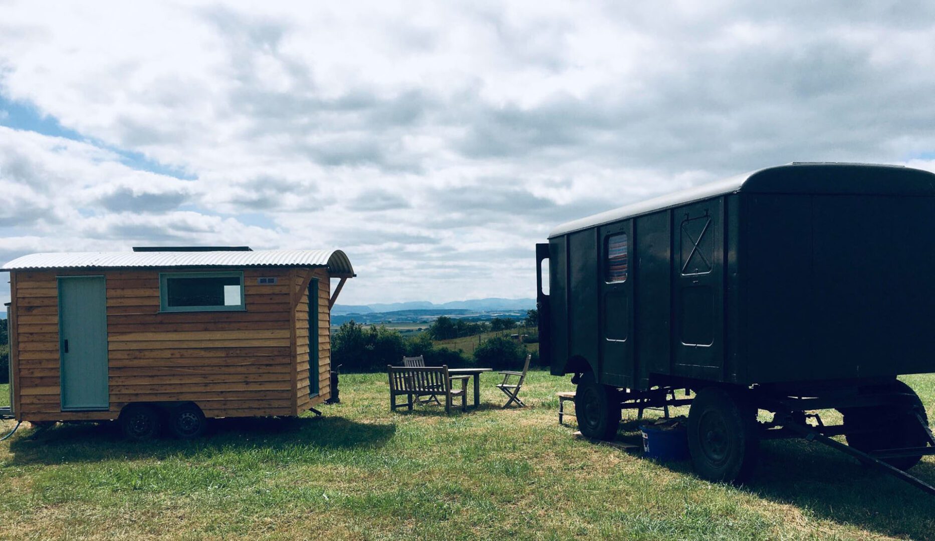 2x glamping units with table and chiars
