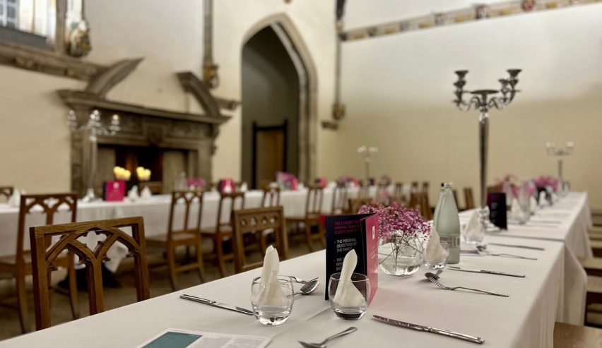 grand dining hall with long trestle tables