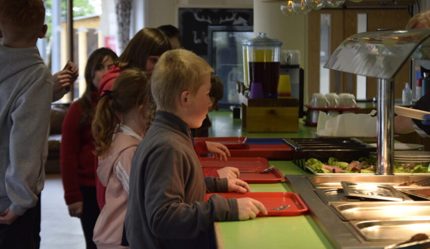 Children queuing for food at the cafe at Mount Cook Adventure Centre