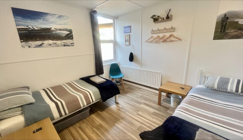 Family room with double bed and single bed at Hafren Forest Hideaway in the Cambrian Mountains, Wales