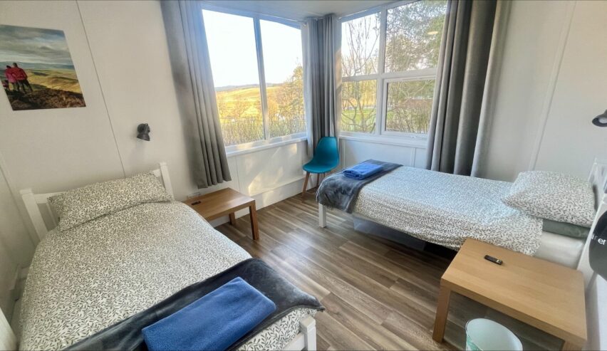 Family room with double bed and single bed atHafren Forest Hideaway in the Cambrian Mountains, Wales
