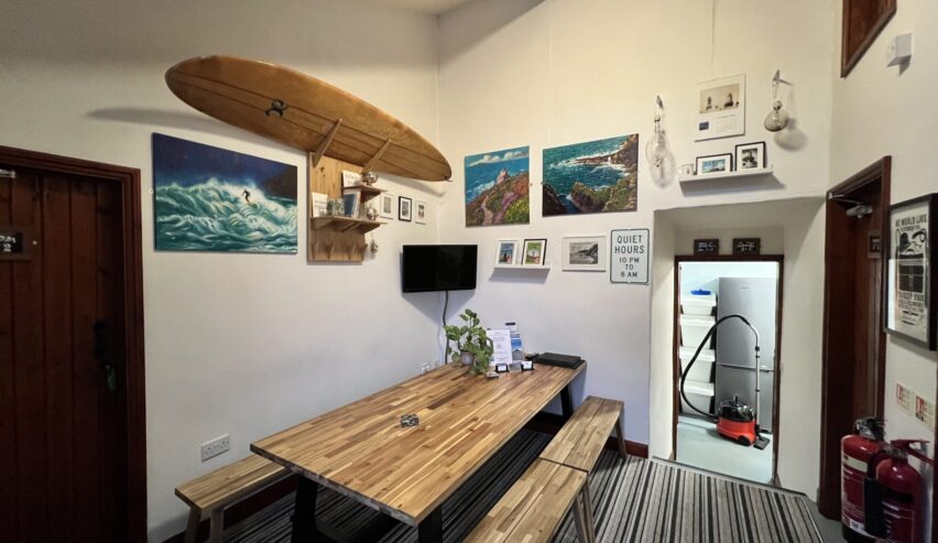lounge with surf coard at lands end hostel