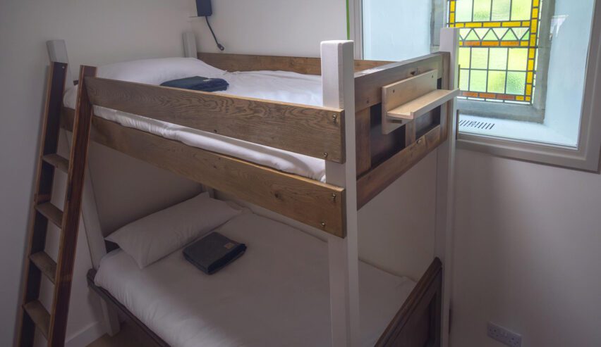 bunk and stained glass window in St.Michael's Lodge hostel,
