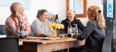 Diners eating together at a hostel