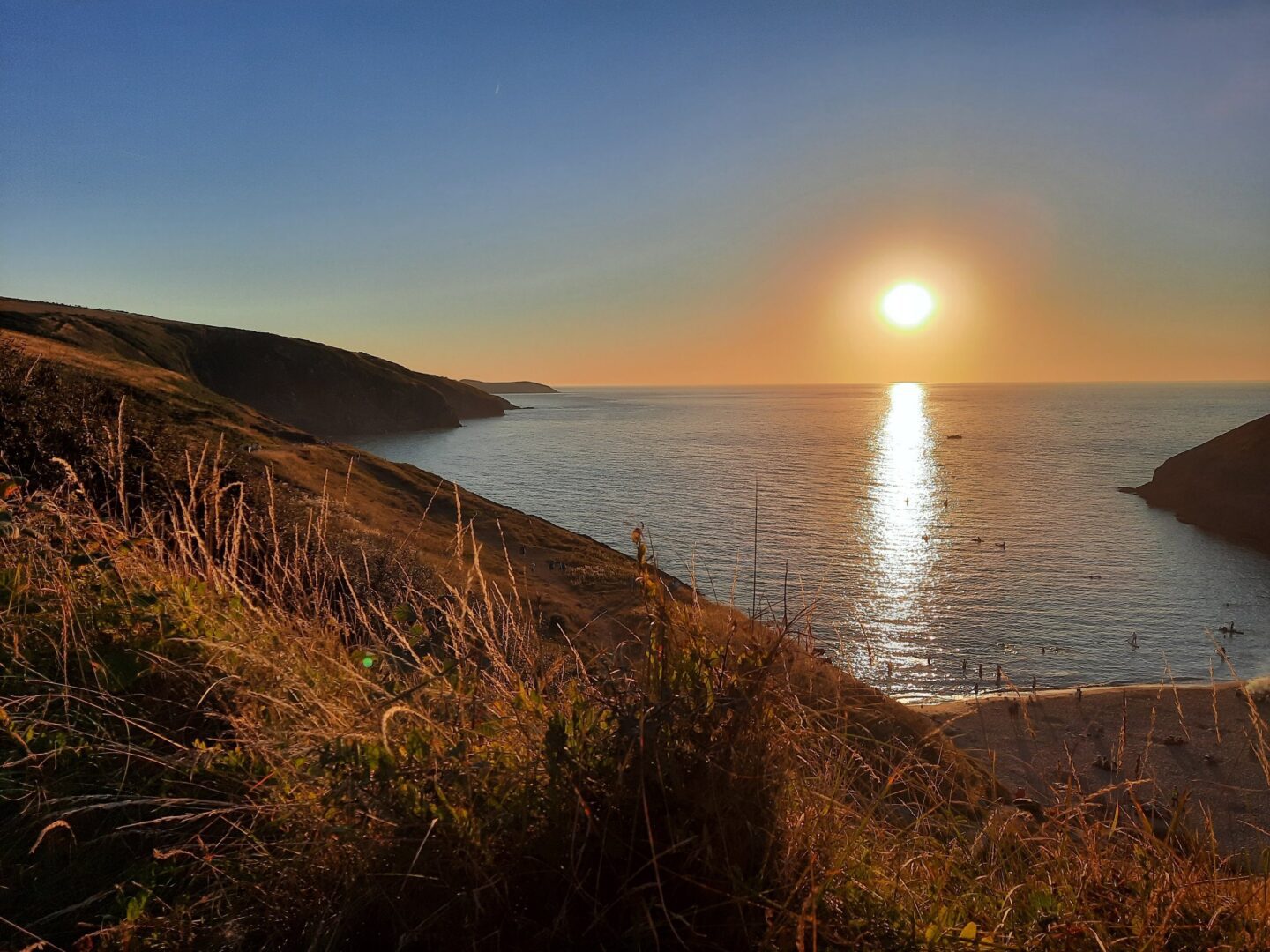 sunset over cardigan bay ideal for wild swimming
