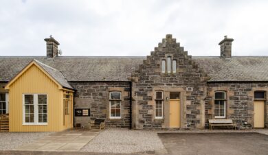 Exterior of converted Railway Booking office at Kingussie Station In teh Cairngorms. Now Railway Rooms group accommodation