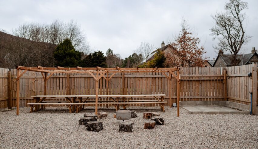 Outsied benches and fire pit at Railway Rooms Kingussie