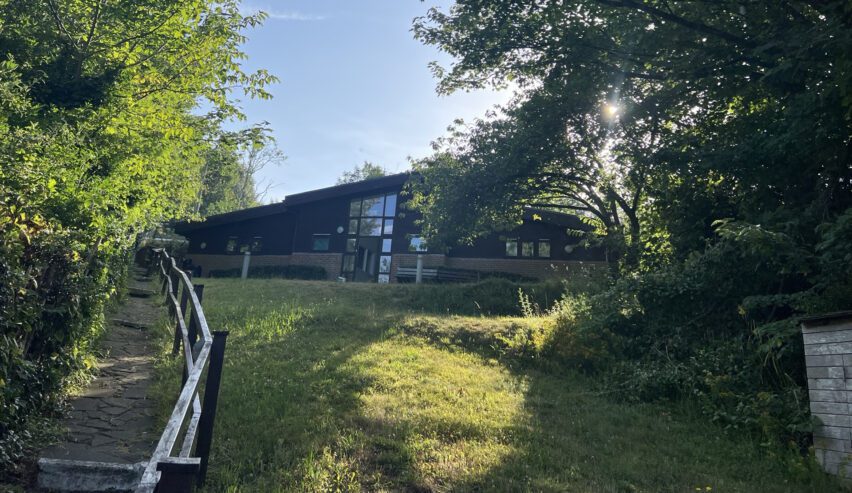 side view of the modern exterior the wooden hostel building