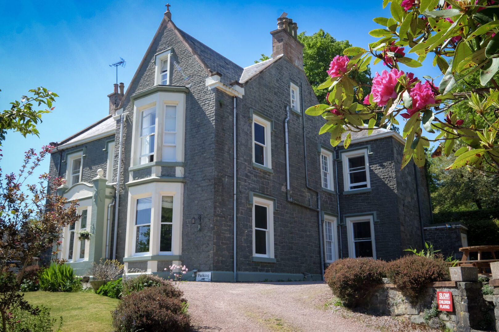 exterior view of moffat hostel with rose flower