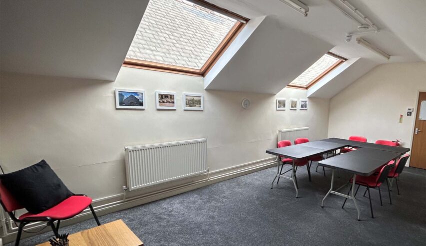 bradwell war memorial hall hostel upstairs room with table and chairs