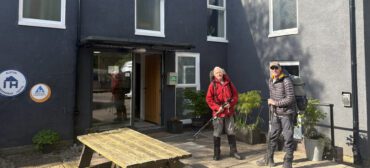 Alston Youth Hostel with two walkers outside