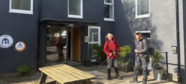 Alston Youth Hostel with two walkers outside