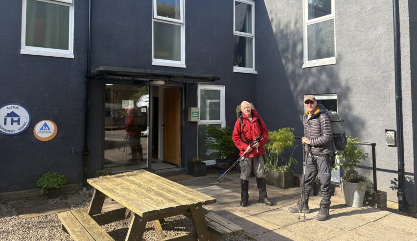 Alston Youth Hostel with two walkers outside