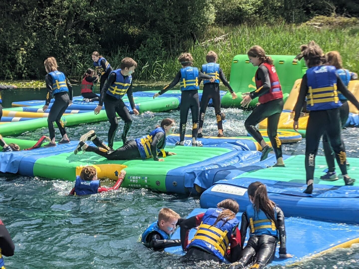 school children enjoying waterpark at culumus centre in dorset