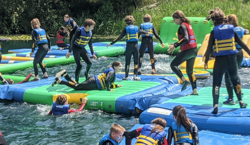 school children enjoying waterpark at culumus centre in dorset