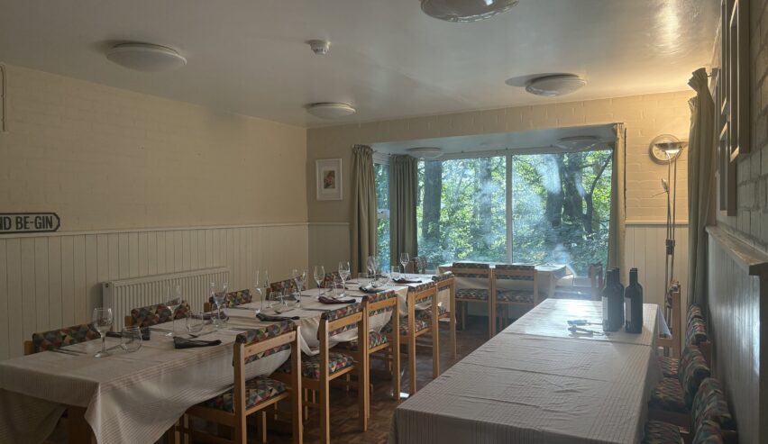 Dining rooms set for a meal at alston hostel