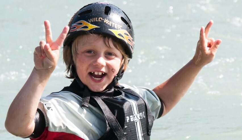child enjoying canoeing with the llandysul paddle on a school residential at The Long Barn