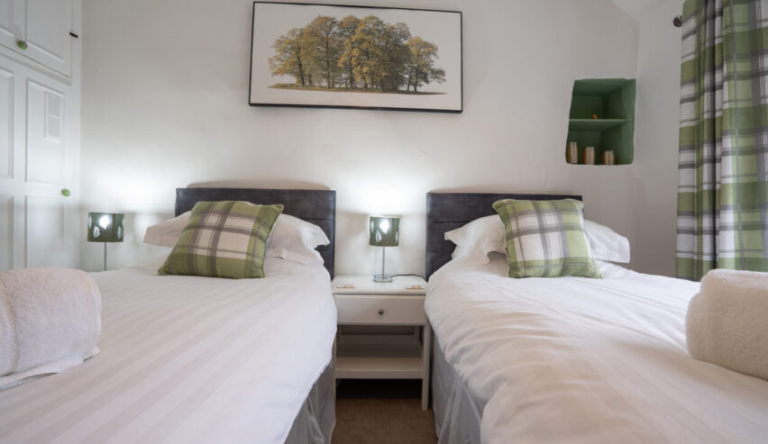 twin beds in bedrooms at cosy Cottage in Youlgreave