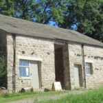 external view of broadrrake bunkhouse showing tree behind