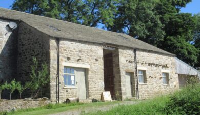 external view of broadrrake bunkhouse showing tree behind