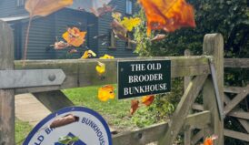 Gateway of old brooder bunkhouse with bunkhouse name and independent hostels sign