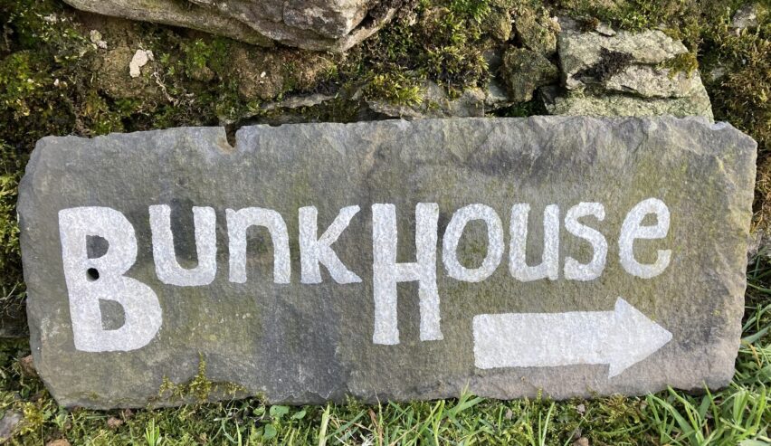 bunkhouse writtend on a stone outside Witherslack Cycle Barn