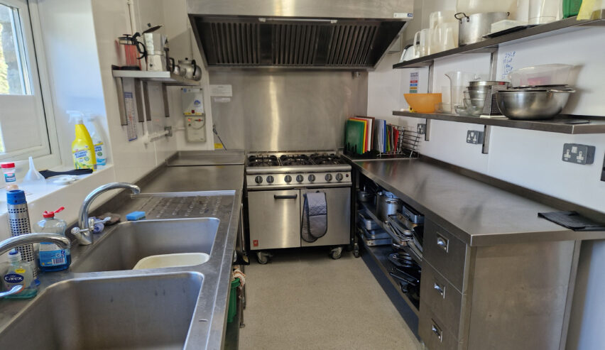 kitchen at yr hafod hostel shwoing commerical cooker and equipment