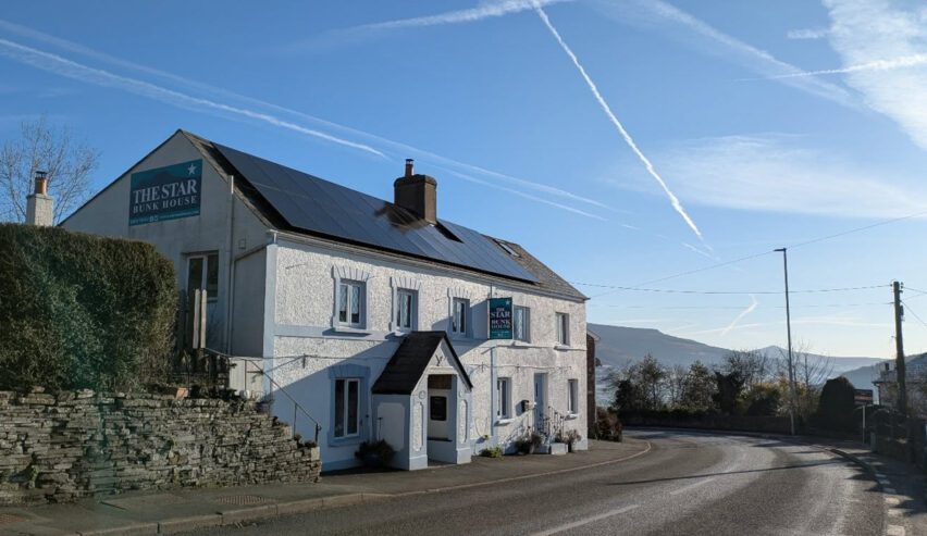 star bunkhouse external photo on a clear crips day showing the mountains behind