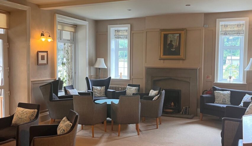 lounge at the nightingale centre showing fireplaces and comfy chairs and tables