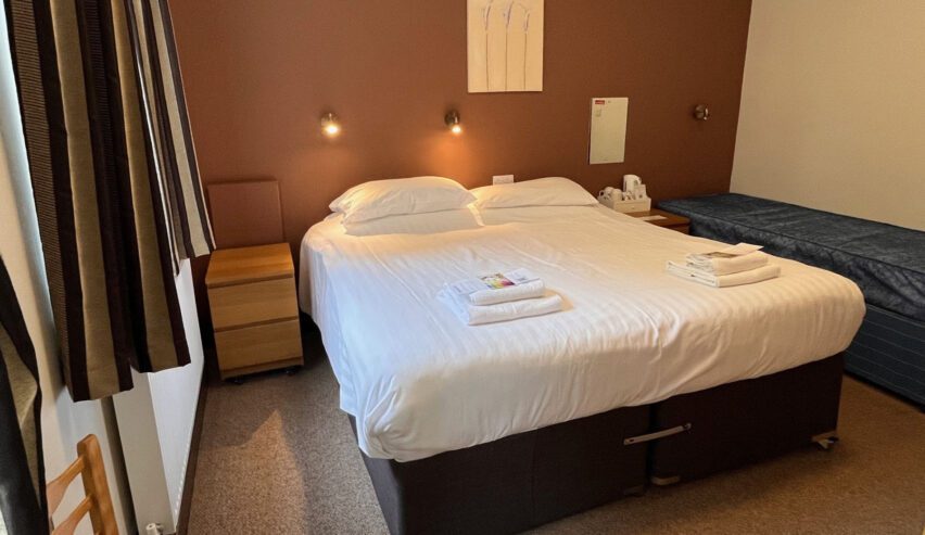 double bed in a private bedroom at the nightingale centre