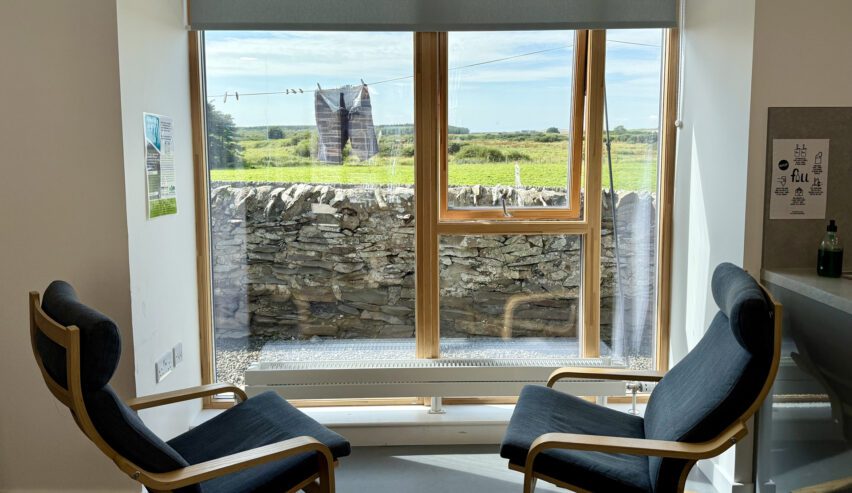 view out of the pation windoes showing fields and stone walls at new town hall bunkhouse whithorn