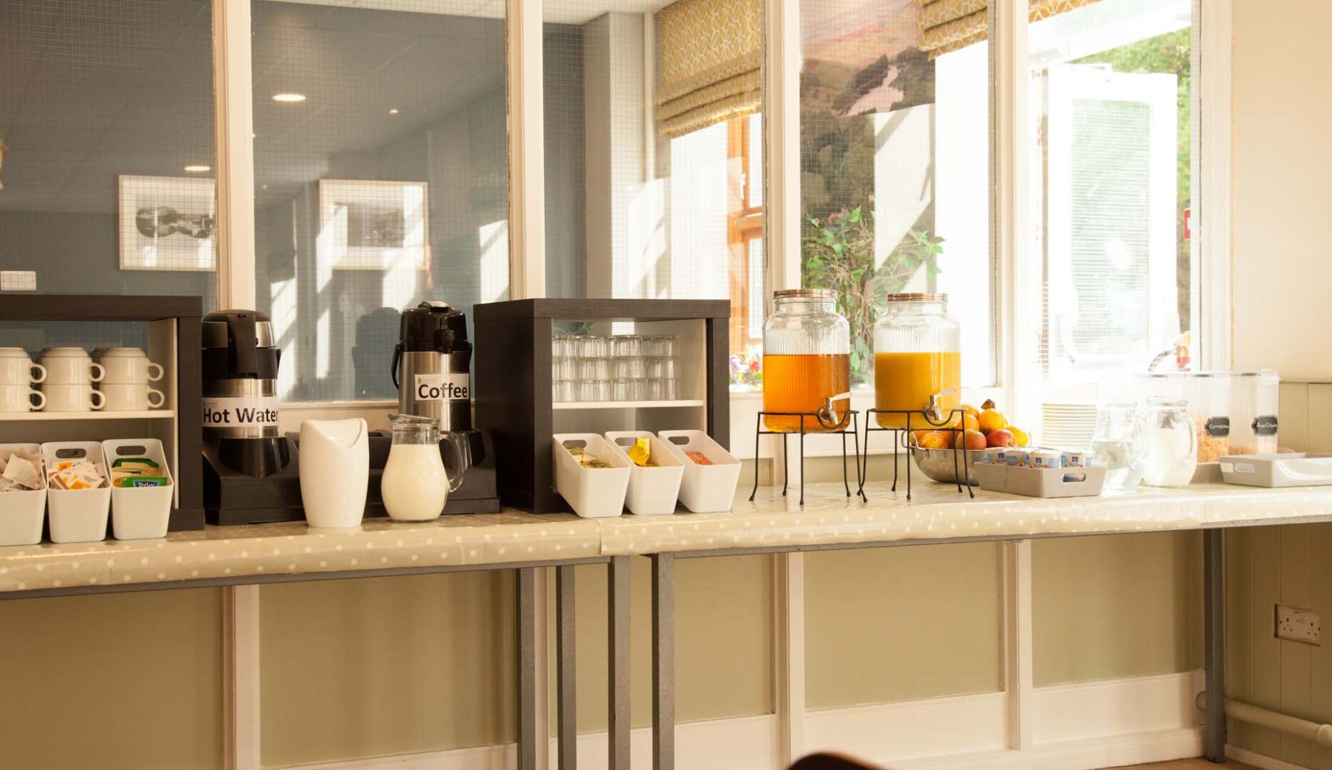 breakfast bar showing orange juice and pastrys at cote ghyl mill