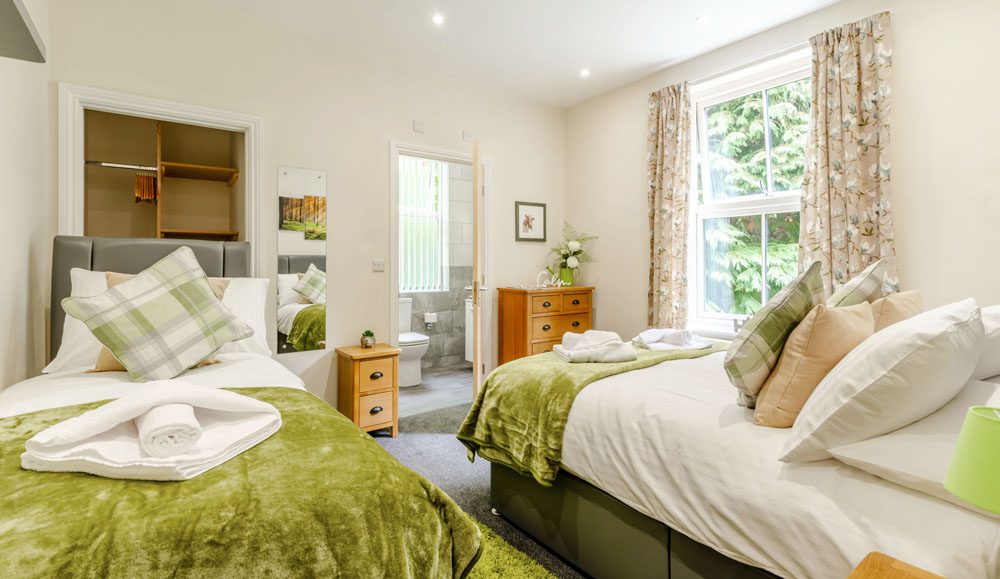 bedroom at cote ghyll mill B&B showing 3 single beds