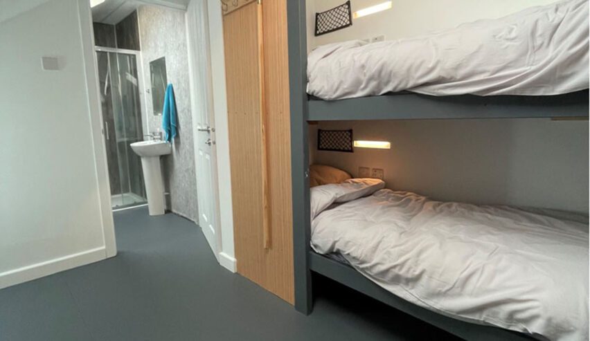 bunkbeds and en-suite bathroom at caban caron