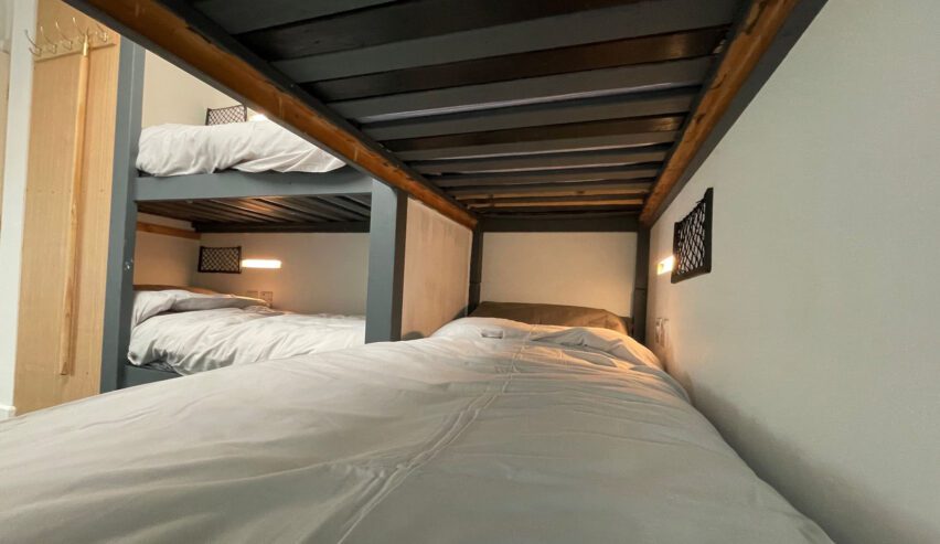 single bunkbed with bunkbeds behind at caban caron