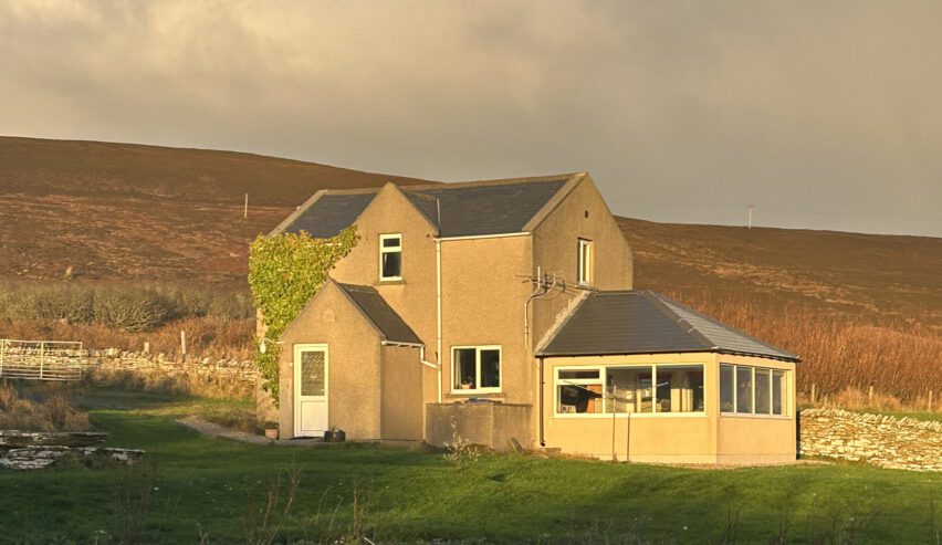 hostel in the evening sunlight on the orkney island of rousay