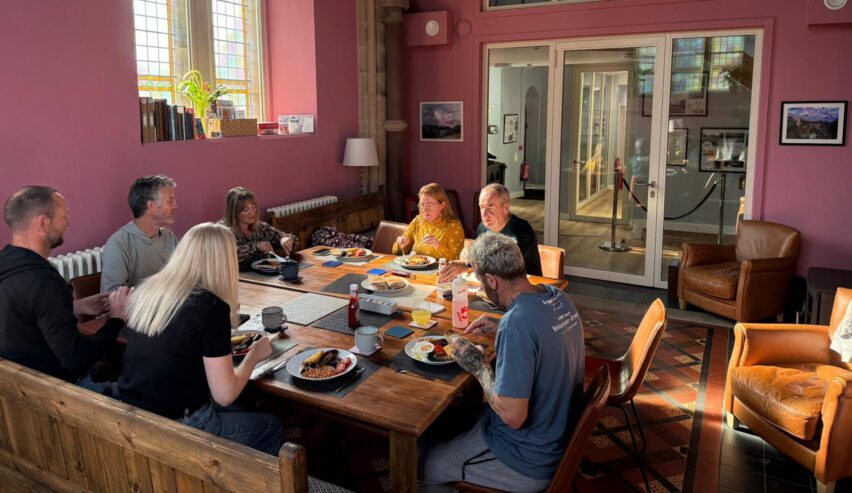 group of people eating a meal at st michaels lodge