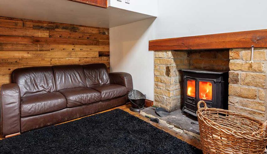 cosy log burner and sofa at Carrs Farm Bunkhouse
