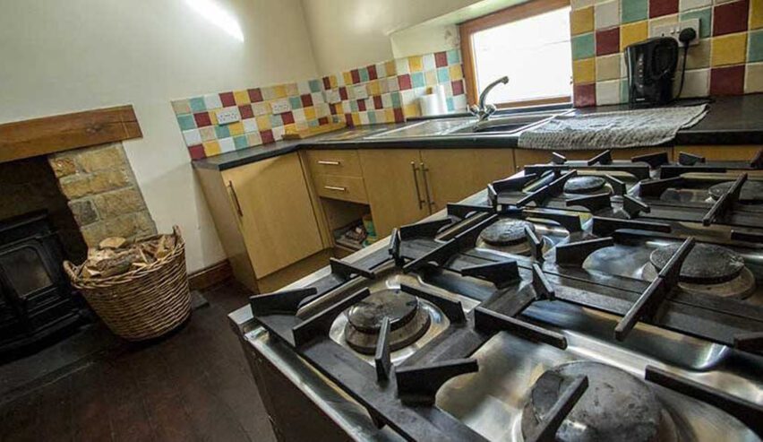 stove and log burner in the kitchen at Carrs Farm Bunkhouse