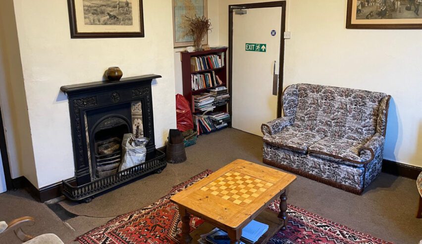 lounge with books and games at bridges hostel on the long mynd