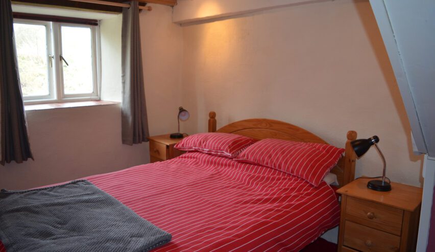 cottage bedroom with double bed at refuge bunkhouse Gernos Fawr