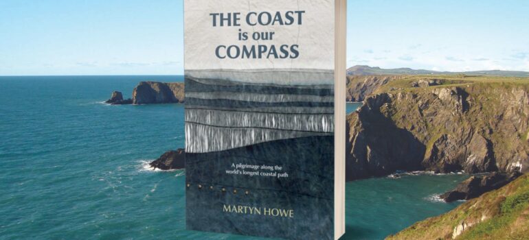The coast is our compass book cover on background photo of the south west coast path