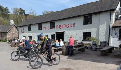 cyclists outside bridges inn in the long mynd