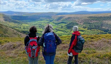 walkers on offas dyke over the black mountains