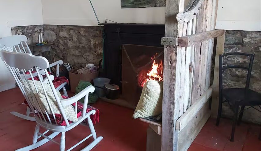 rocking chair and fire at bearnus bothy on the isle of ulva
